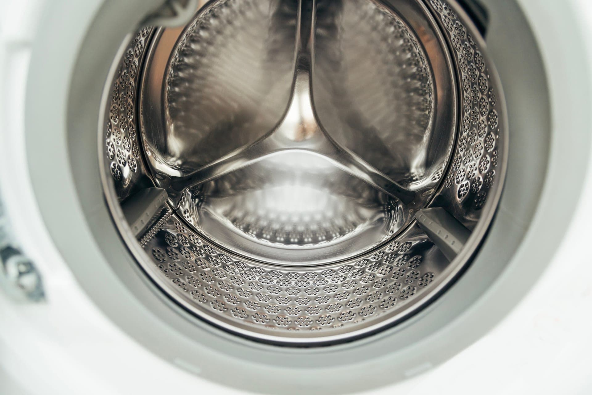 The stainless drum of a front-loading washing machine