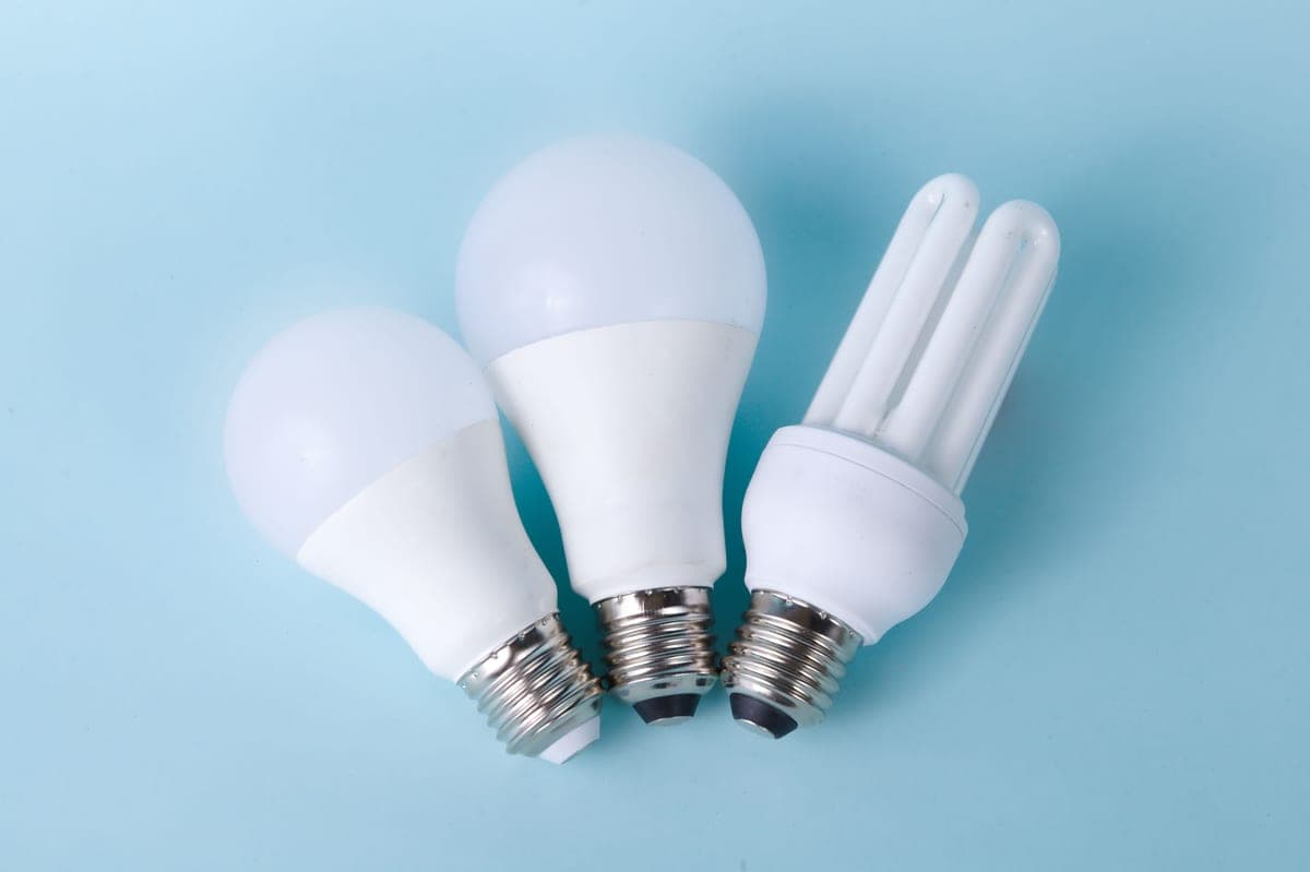 An energy-saving light bulb against a plain background
