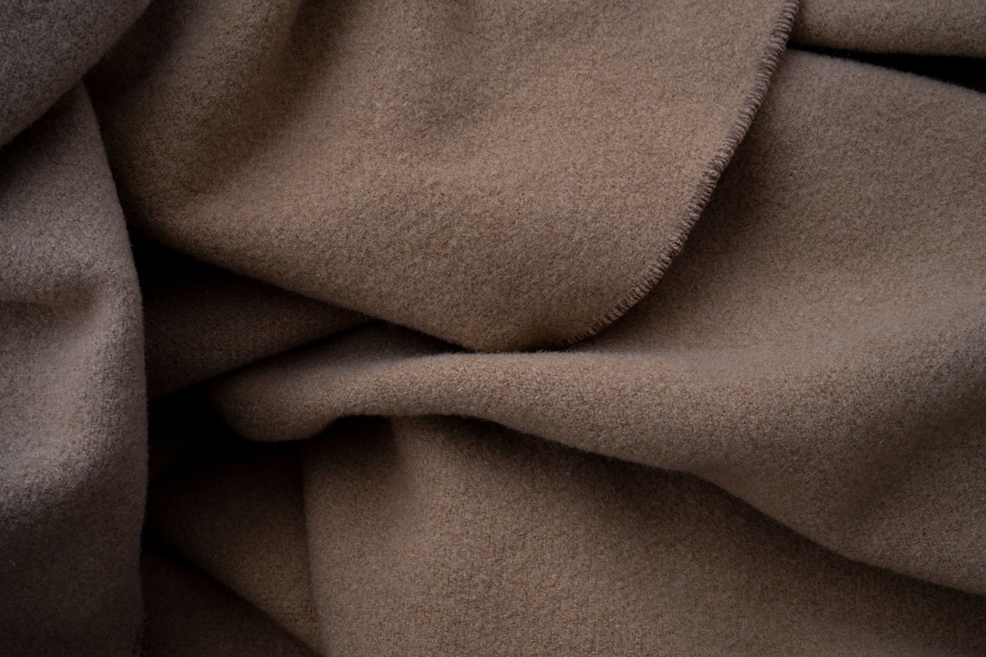 A close-up of soft brown textured fabric