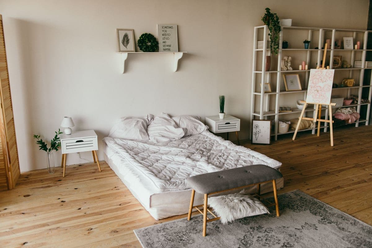 An empty bed with pillows on both sides
