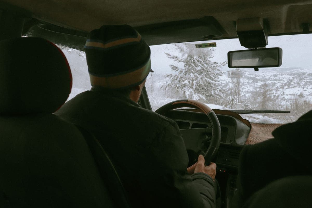 A car interior and dashboard on a winter road trip