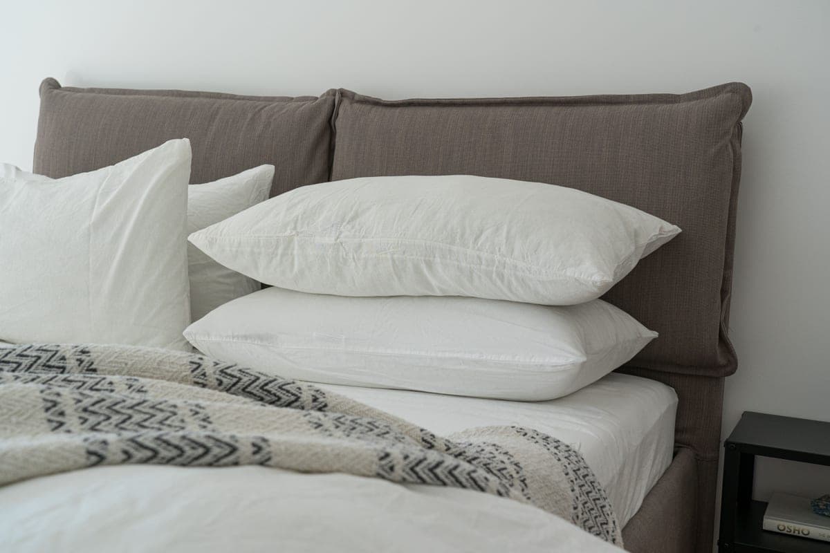 Layered bed sheets and mattress at one corner